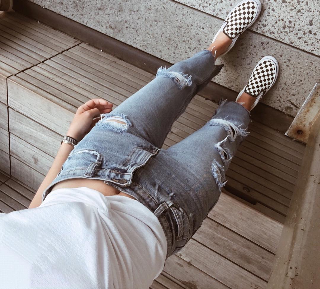 ripped jeans and checkered vans